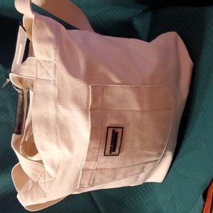 Super cute cream colored canvas bag holds alot of stuff!